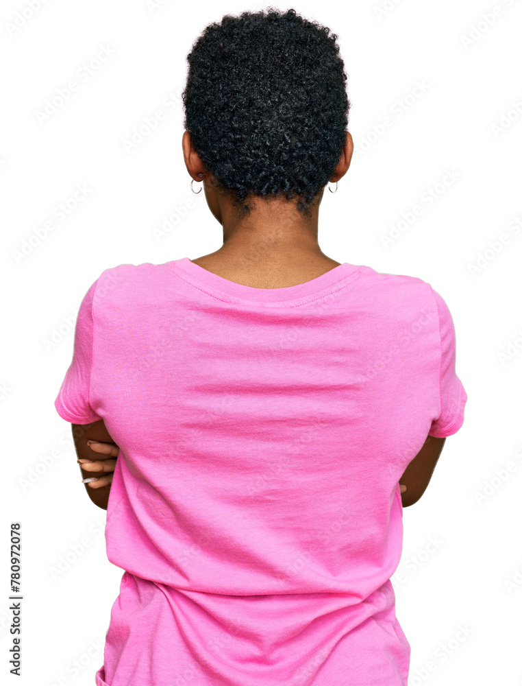 Sticker young african american woman wearing casual clothes standing backwards looking away with crossed arm