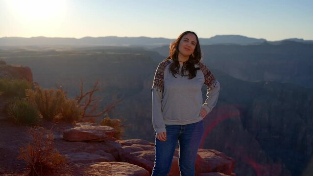 Native American girl is fascinated by the breathtaking beauty of the Grand Canyon - travel photography