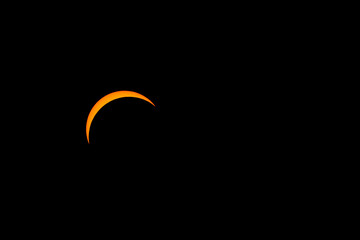 The solar eclipse before totality on April 8, 2024. Only a thin crescent of the sun is visible.