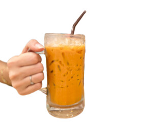hand holding glass of milk tea 