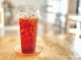 glass of cola ice  black tea  on  table in cafe