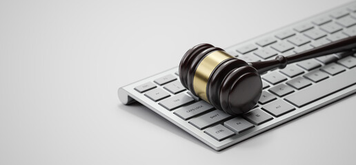 Gavel at the computer keyboard: Legal and law concept. Wooden hammer of justice and order - 780983231