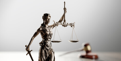 Legal Concept: Themis is the goddess of justice and the judge's gavel hammer as a symbol of law and order - 780983475