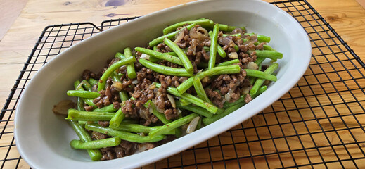 String green bean or french beans with minced beef stir fry or sauteed called Tumis buncis daging...