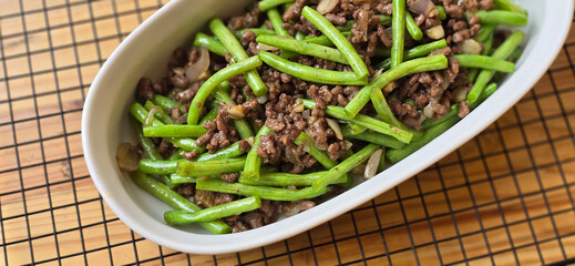 String green bean or french beans with minced beef stir fry or sauteed called Tumis buncis daging...