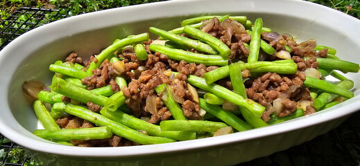 String green bean or french beans with minced beef stir fry or sauteed called Tumis buncis daging sapi cincang in Indonesia