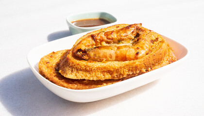 Bread fried with shrimp or banh mi chien tom. Vietnamese street cuisine. Bread slices are dipped in a batter made of wheat, tapioca, and rice flour. Then it's fried with shrimp. Eat with hoisin sauce.