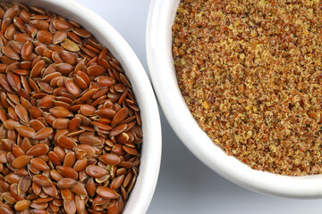 Pile of flax seeds isolated on white background
