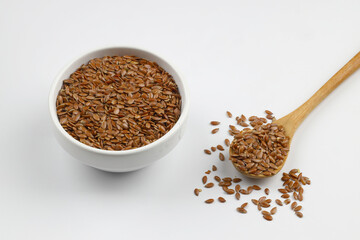 Pile of flax seeds isolated on white background