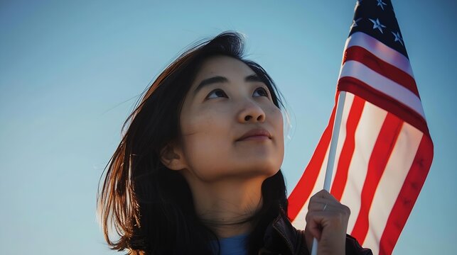 Generative AI : Young asian woman holding American flag on blue sky background