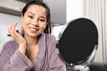 Morning Routine Of Woman In Bathrobe With Mirror