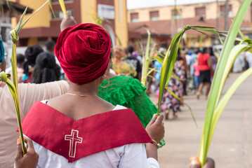 Women holding palms as Members of ST. Mary Cathedral participates in a Palm Sunday procession in...