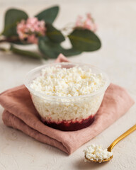 Layered cottage cheese and jam for a delightful treat, accented with soft florals.