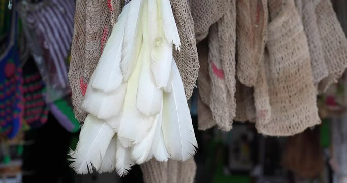 Jayapura, Papua-Indonesia, December 2023: Typical Papuan handicrafts as souvenirs that can be purchased by tourists in the form of thread nokens, bark nokens and koteka. You can get it at the Hamadi