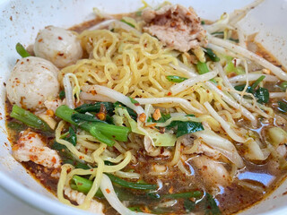 spicy noodles with pork and meatball, thai cuisine