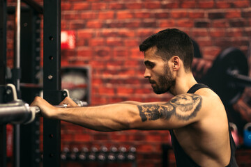 determined strong man focus on training in a gym