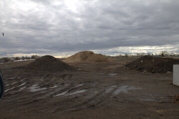 three piles with sky background