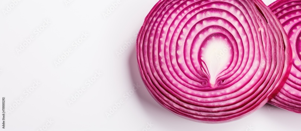 Poster close-up view of a red onion sliced and arranged on a clean white surface.