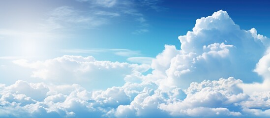 Sun shining brightly in a sky filled with fluffy white clouds, creating a picturesque scene