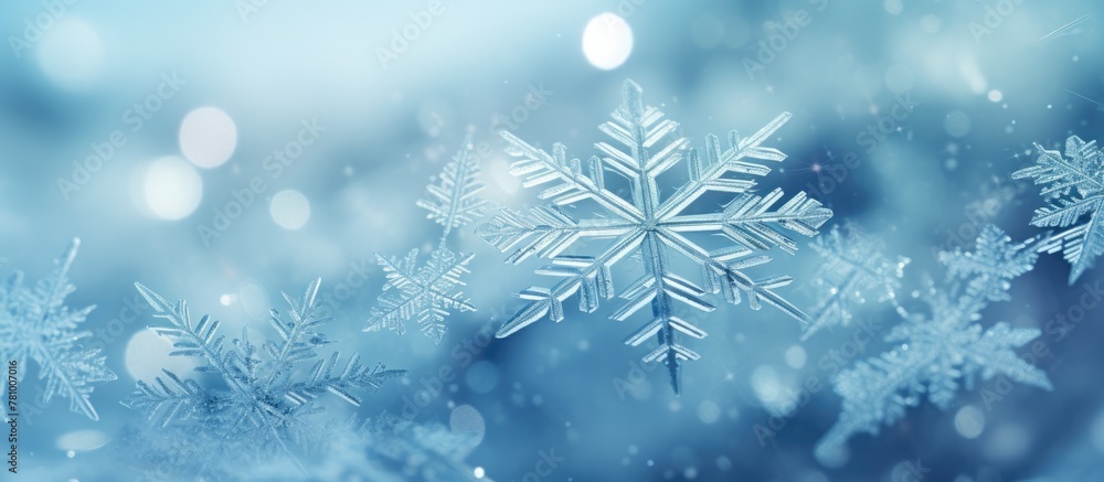 Aufkleber snowflakes gently descending from the sky, creating a serene atmosphere against a backdrop of clear 