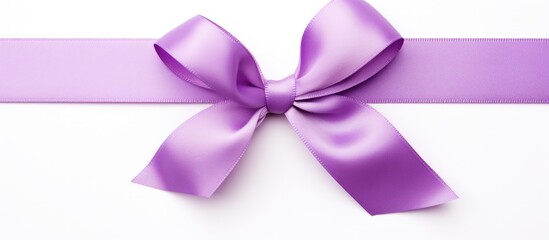 A simple purple ribbon with a neatly tied bow placed on a clean white background