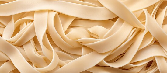 Close-up view of a heap of pasta noodles, showcasing their texture and shapes, set against a clean...