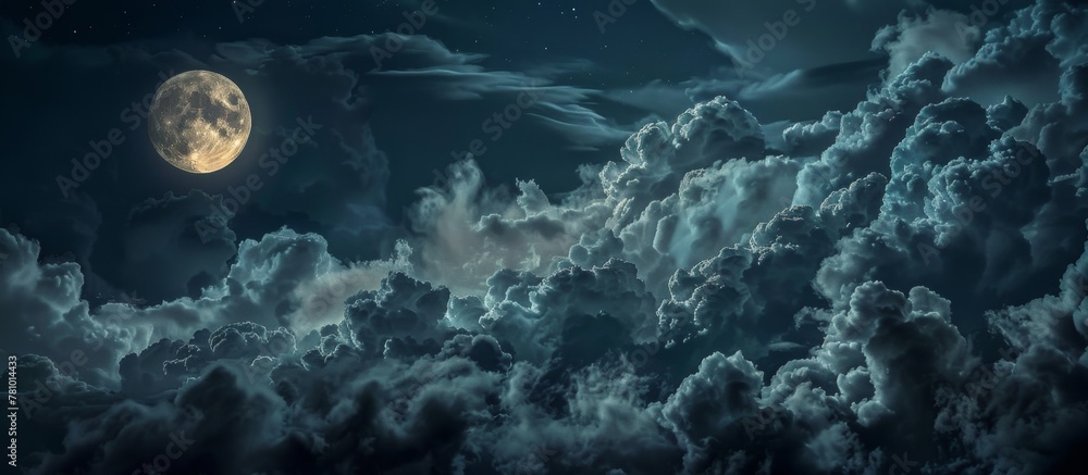 Poster the luminous full moon is visible high in the sky, peering through a layer of fluffy clouds
