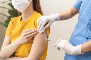 Health care, corona virus, hand of woman nurse, doctor giving syringe vaccine, injection dose on arm sick patient at clinic. Vaccination, immunization disease prevention against flu pandemic influenza - obrazy, fototapety, plakaty