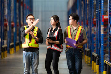 A group of warehouse employees, Inspecting products on warehouse shelves before they are sent to retailer