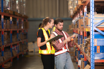 A group of warehouse employees, Inspecting products on warehouse shelves before they are sent to...