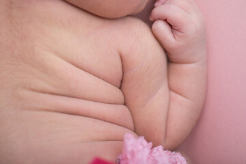 Fototapeta na wymiar Super cute newborn baby skin rolls