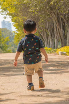 Child running free and happy in a park in Lima peru