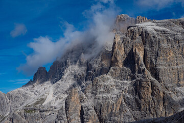 Clouds rolling in over the dramatic peaks of the mountains in the Dolomites Italy - Dolomiti National Park