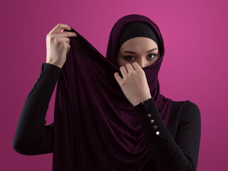 Modern Muslim woman wearing stylish hijab casual wear isolated on pink background. Diverse people model hijab fashion concept. - 781032847