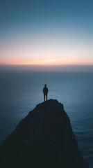 A lonely figure on a high cliff overlooking the ocean at dusk, against the background of serene...