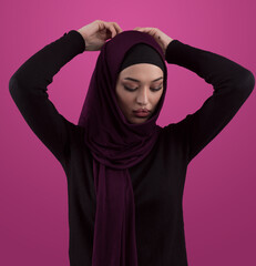 Modern Muslim woman wearing stylish hijab casual wear isolated on pink background. Diverse people model hijab fashion concept. - 781034802