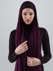 Muslim woman wearing modern stylish wear and hijab isolated on grey background. Diverse people model hijab fashion concept. - 781035633