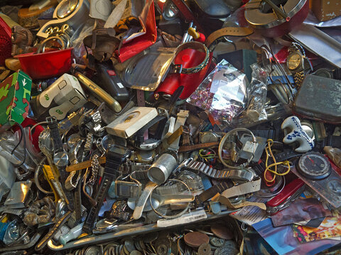 Close up of Pile of miscellaneous old cheap things and various antique items for sale on Hong Kong Flea Market