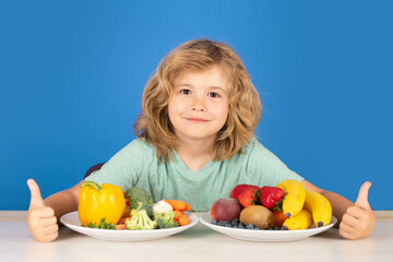 Fototapeta premium Healthy breakfast lunch for kids. Kid with fruits and vegetables. Healthy food.