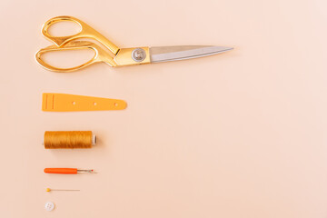 Working tools scissors and sewing threads.