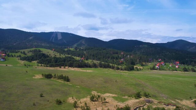 Zlatibor Mountain, Serbia. Flying Above Green Fields Under Tornik Peak on Summer Day, Drone Shot