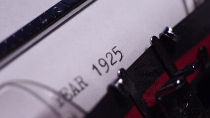 Year 1925, Typing on White Paper in Vintage Typewriter, Macro Close Up