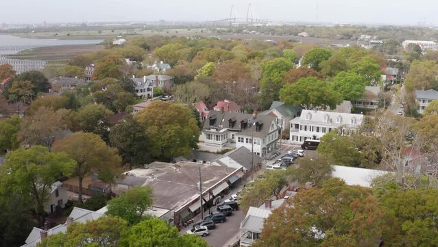 Low close-up aerial shot of historic Old Village Mount Pleasant in South Carolina. 4K