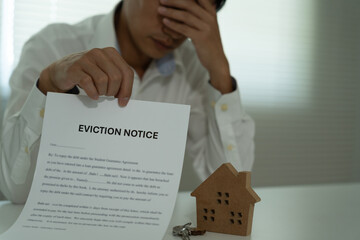 Business man is stressed due to imminent seizure of assets, debts, financial problems, loans,...