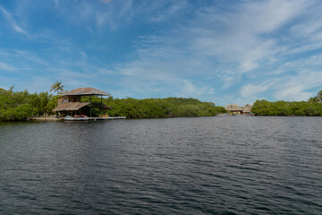 Fototapeta na wymiar Palma island seen from a boat with sea and blue sky. San Bernardo Colombia. 