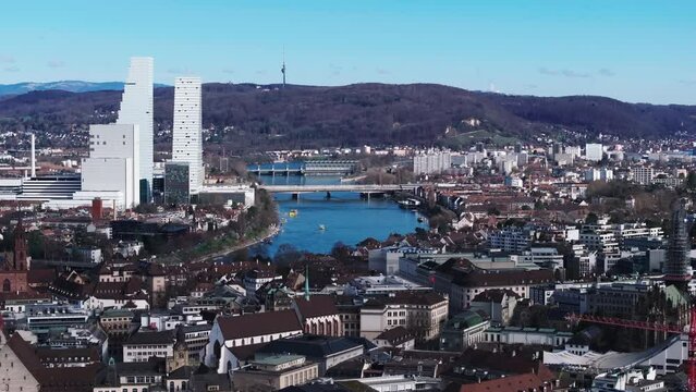 Aerial view of city with river and bridges. Historic town center contrasting with modern high rise Roche Tower skyscrapers. Basel, Switzerland