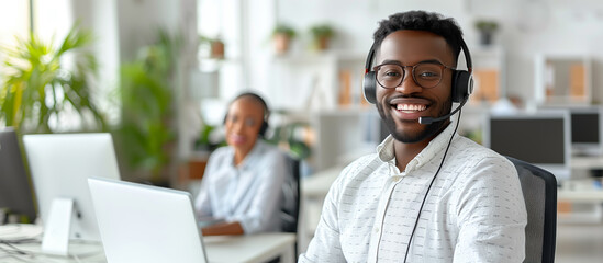 Smiling man with headset in an office, another person in background, representing customer support, Generative AI.
