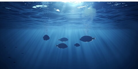 Ocean Ballet: A School of Tuna Fish Glides Through the Sun-Drenched Upper Echelons of the Deep Blue...