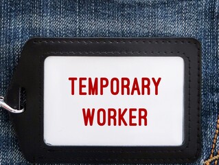 Office ID card on jeans with position title TEMPORARY WORKER, worker - refers to temporary...
