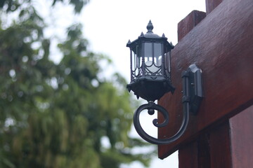 Lantern on the wooden door in the park, Gorontalo, Indonesia